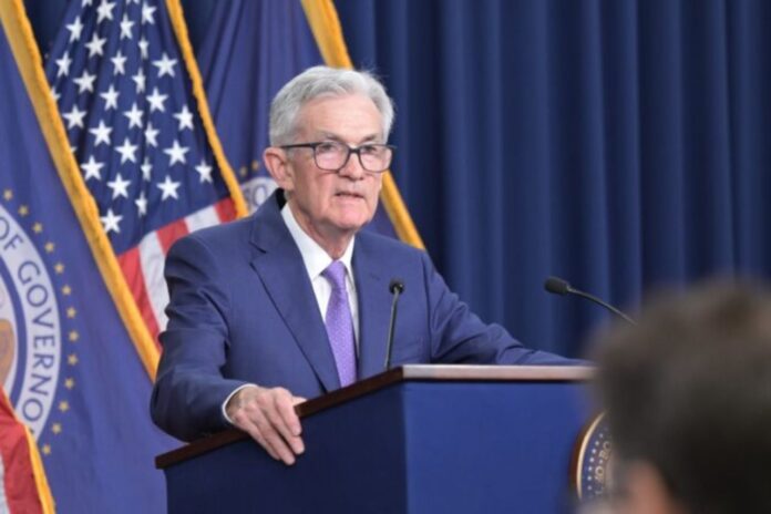 The Federal Reserve kept interest rates unchanged on Wednesday but acknowledged recent progress on inflation and a cooling labor market, sparking investor hopes that the central bank might soon begin cutting rates.